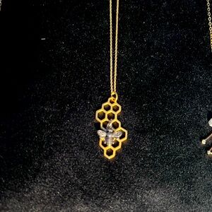 .925 silver Bee on gold honeycomb pendant. hangs on 8” chain